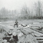 Grandpa Spencer on a river of logs