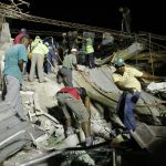 Residents search for victims after an earthquake in Port-au-Prince